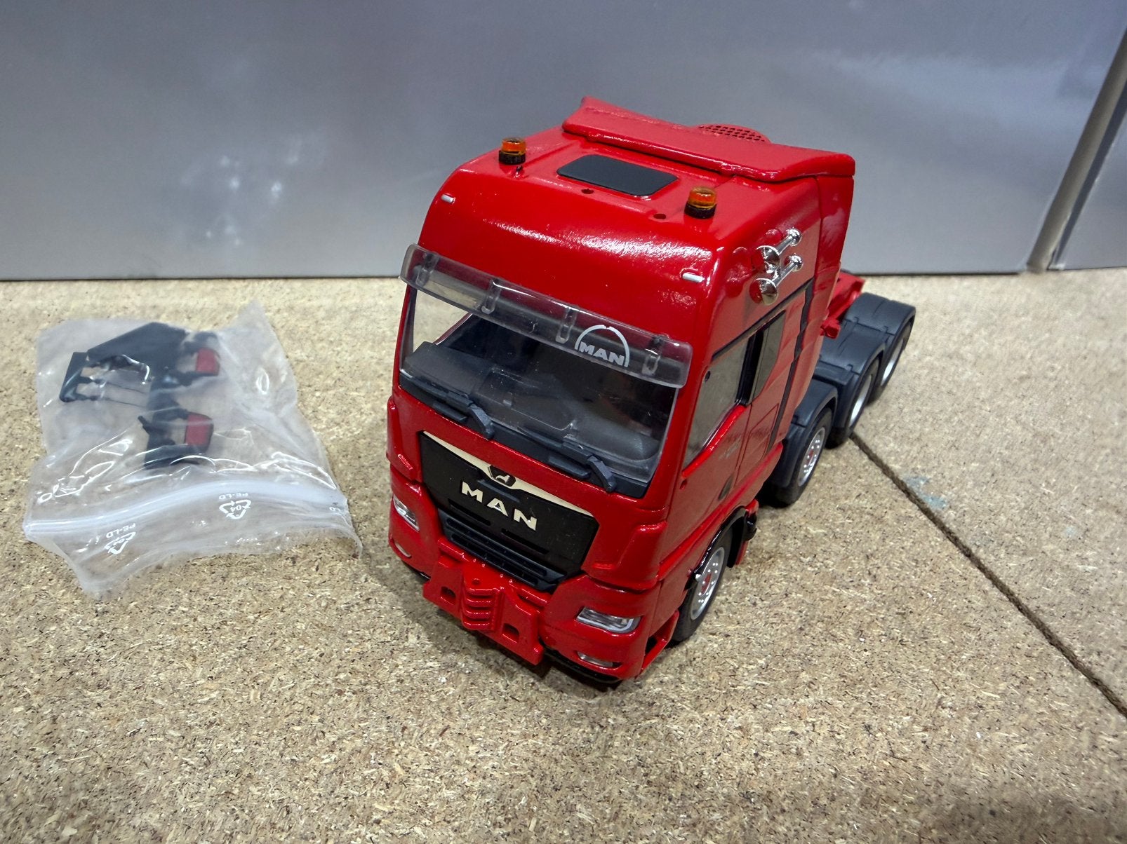 CONRAD MAN TGX 8x4ZWAAR TRANSPORT, Hobby en Vrije tijd, Modelauto's | 1:50, Ophalen of Verzenden, Nieuw, Bus of Vrachtwagen, Conrad