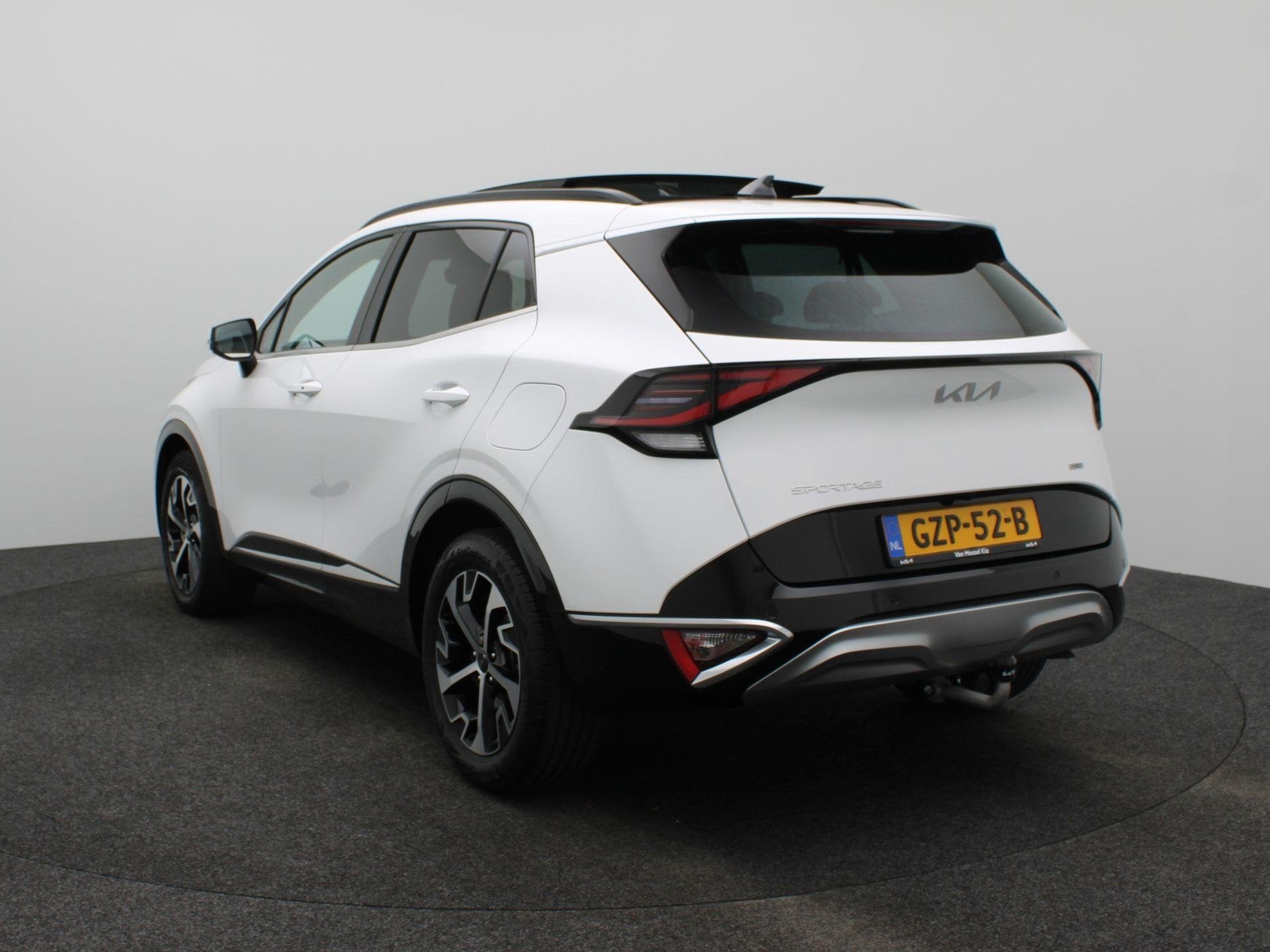 Kia Sportage 1.6 T-GDi Hybrid DynamicPlusLine | Pano Dank |, Auto's, Gebruikt, Euro 6, 4 cilinders, Leder en Stof