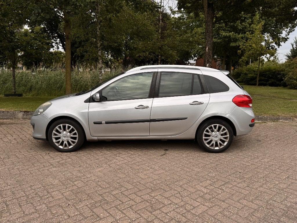 Renault Clio 1.6 16V Estate Automaat 2008 Grijs, Auto's, Zwart, 4 cilinders, 49 €/maand, Origineel Nederlands