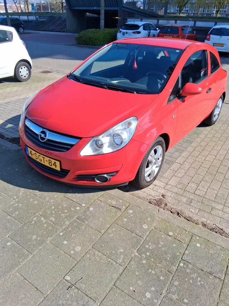 Opel Corsa 1.0 12V 3D 2009 Rood, Auto's, Opel, Voorwielaandrijving, 40 €/maand, Handgeschakeld, Grijs