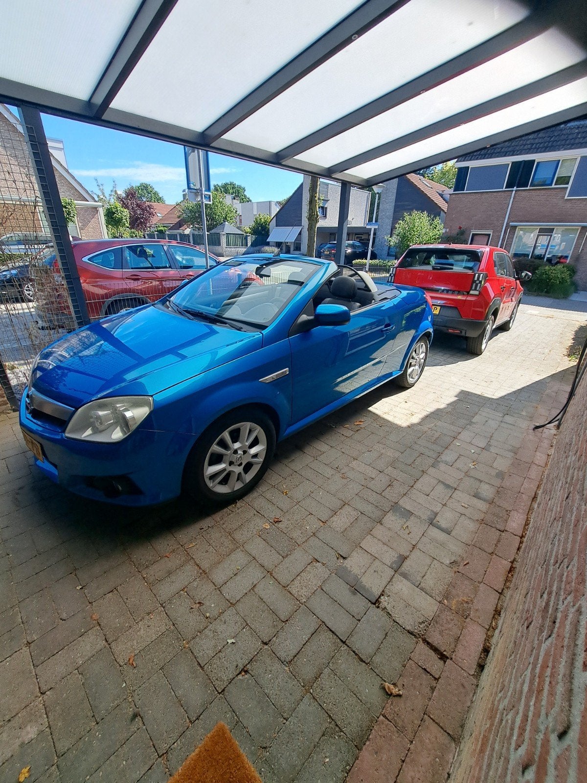 Opel Tigra 1.8 16V Twintop 2006 Blauw, Auto's, Opel, 125 pk, Zwart, 4 cilinders, Blauw