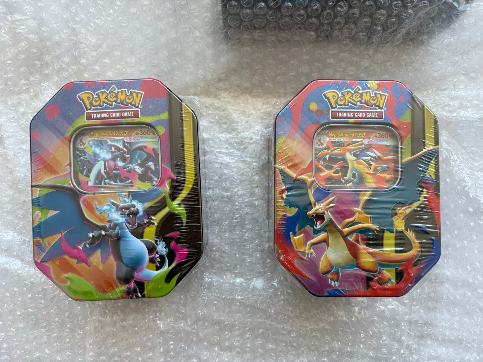 Setje Charizard x en y ex tin, Ophalen of Verzenden