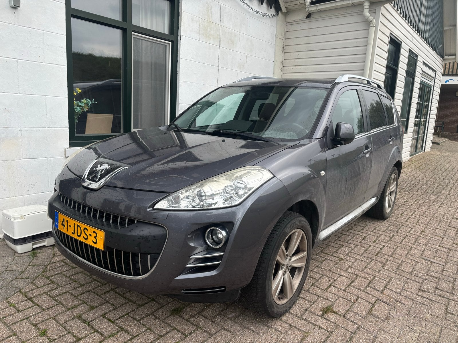 Peugeot 4007 2.4 16V 4WD 7P 2009 Grijs, Auto's, 4 cilinders, 7 stoelen, Origineel Nederlands, Handgeschakeld