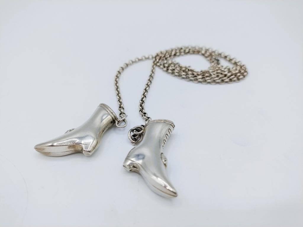Zilveren jasseronketting met breipendoppen (laarzen), 79 cm., Verzenden, Zilver, Ring