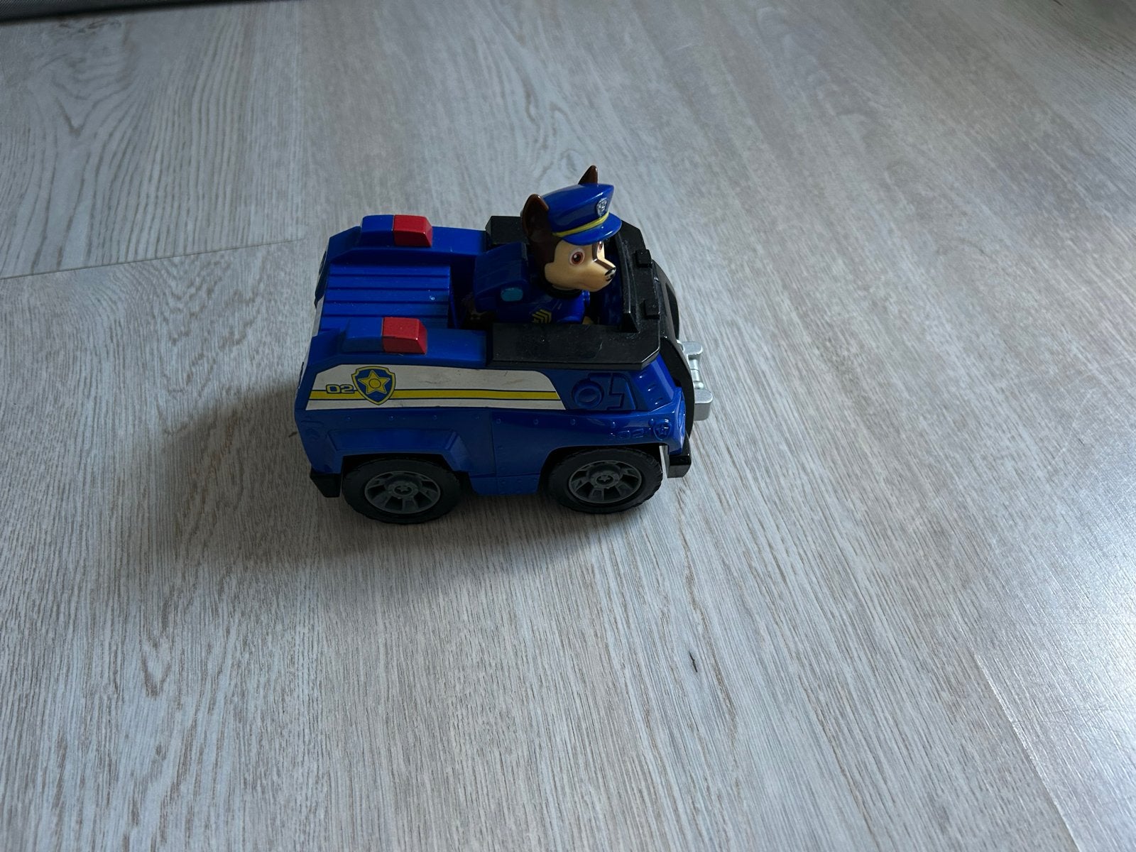 Paw Patrol Chase Politieauto met figuur, Ophalen of Verzenden, Gebruikt