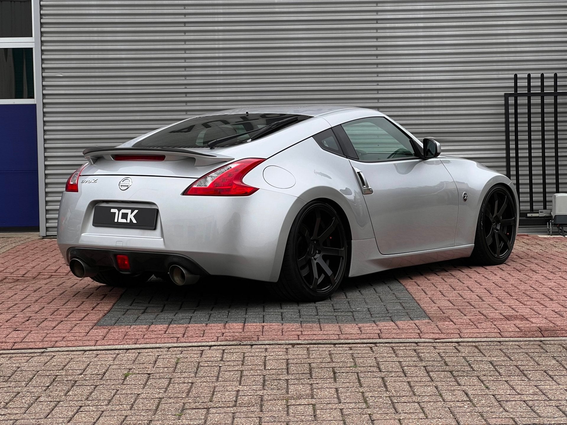 Nissan 370Z 3.7 V6 328PK/BOSE/HANDBAK/20INCH/NAVI/CAMERA, Auto's, Achterwielaandrijving, Gebruikt, Zwart, 10 km/l