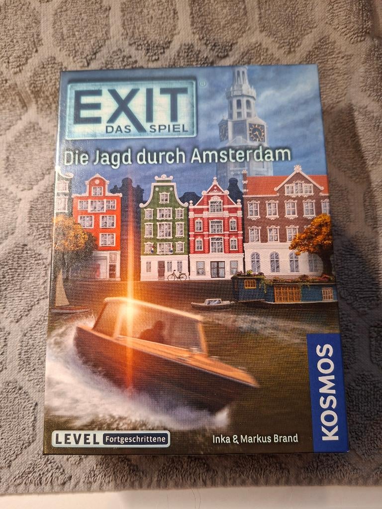 Spel - EXIT das Spiel - Die Jagd durch Amsterdam - KOSMOS, Ophalen of Verzenden, 500 t/m 1500 stukjes, Nieuw, Overige typen