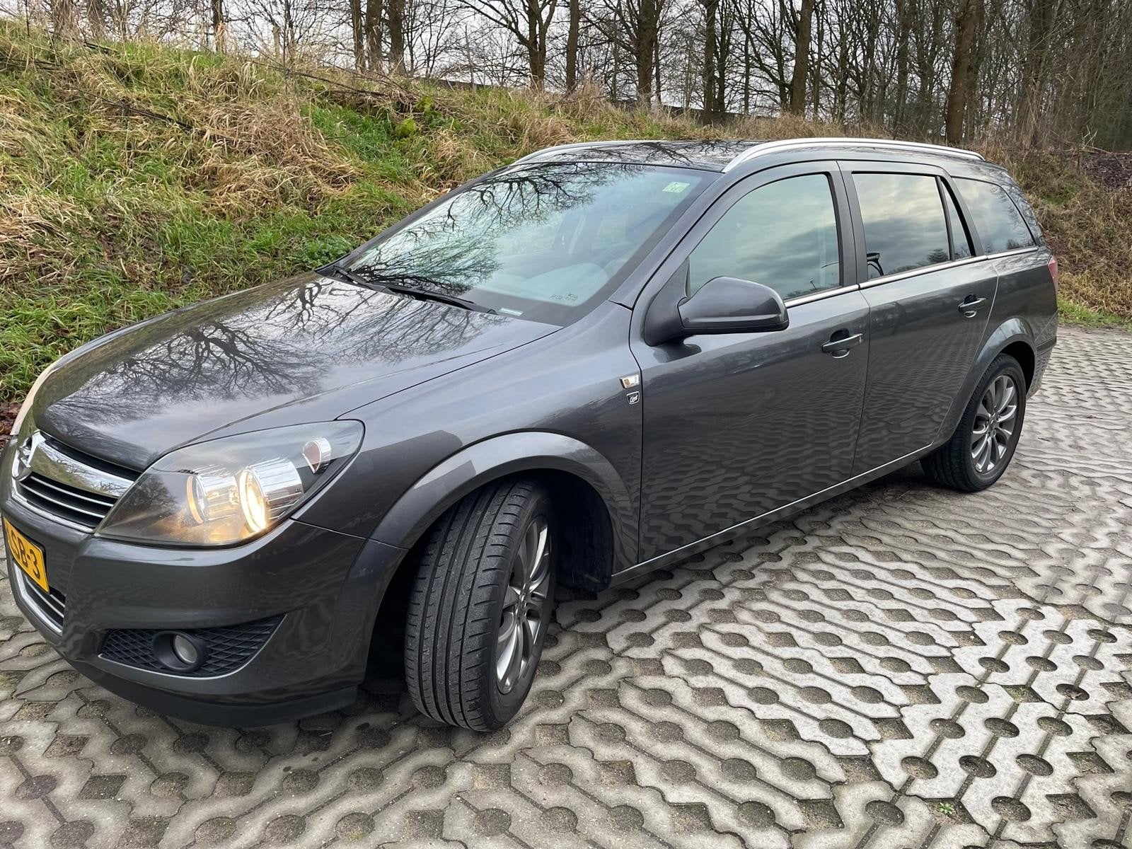 Opel Astra 1.4 16V St.wgn. 2010 Grijs, Voorwielaandrijving, Stof, Origineel Nederlands, Stationwagon