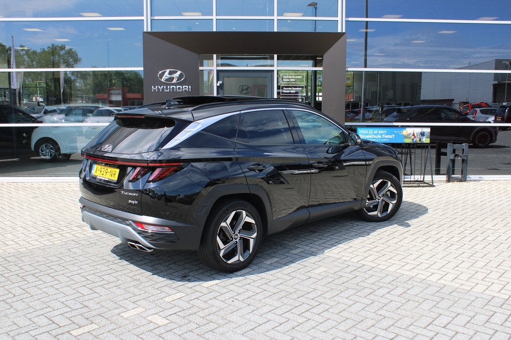 Hyundai Tucson 1.6 T-GDI 265pk PHEV Premium Sky 4WD | Schuif, Auto's, Hyundai, 12 maanden, Gebruikt, Overige carrosserieën, Overige brandstoffen