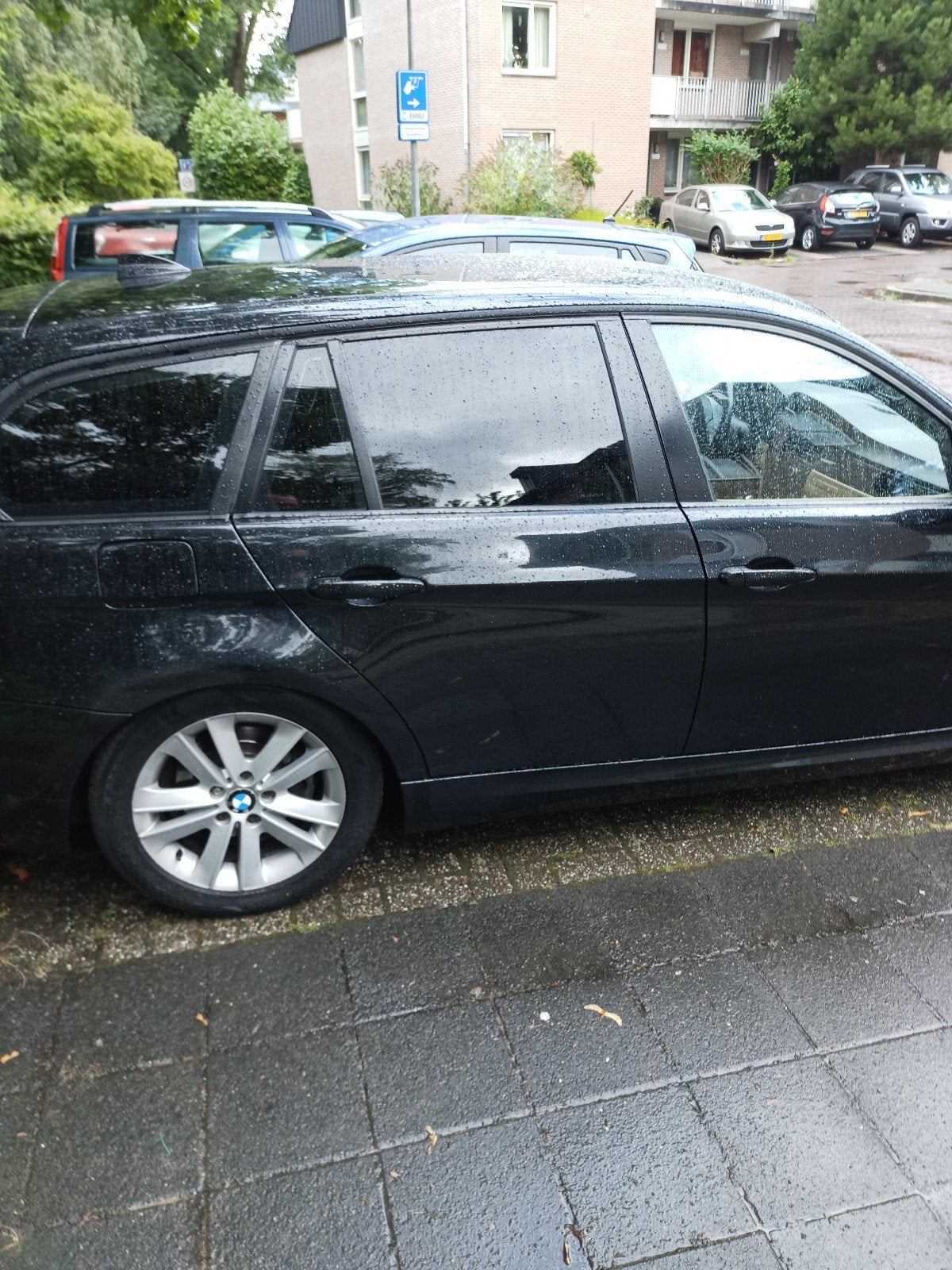 BMW 3-Serie 2.0 318 I Touring 105KW 2009 Zwart, Auto's, Achterwielaandrijving, Zwart, Origineel Nederlands, Handgeschakeld