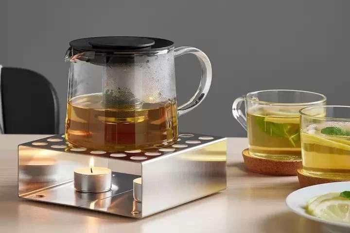 rvs theepotverwarmer/rechaud  design Mikael Warnhammar, Overige typen, Zilver, Ophalen of Verzenden, Zo goed als nieuw