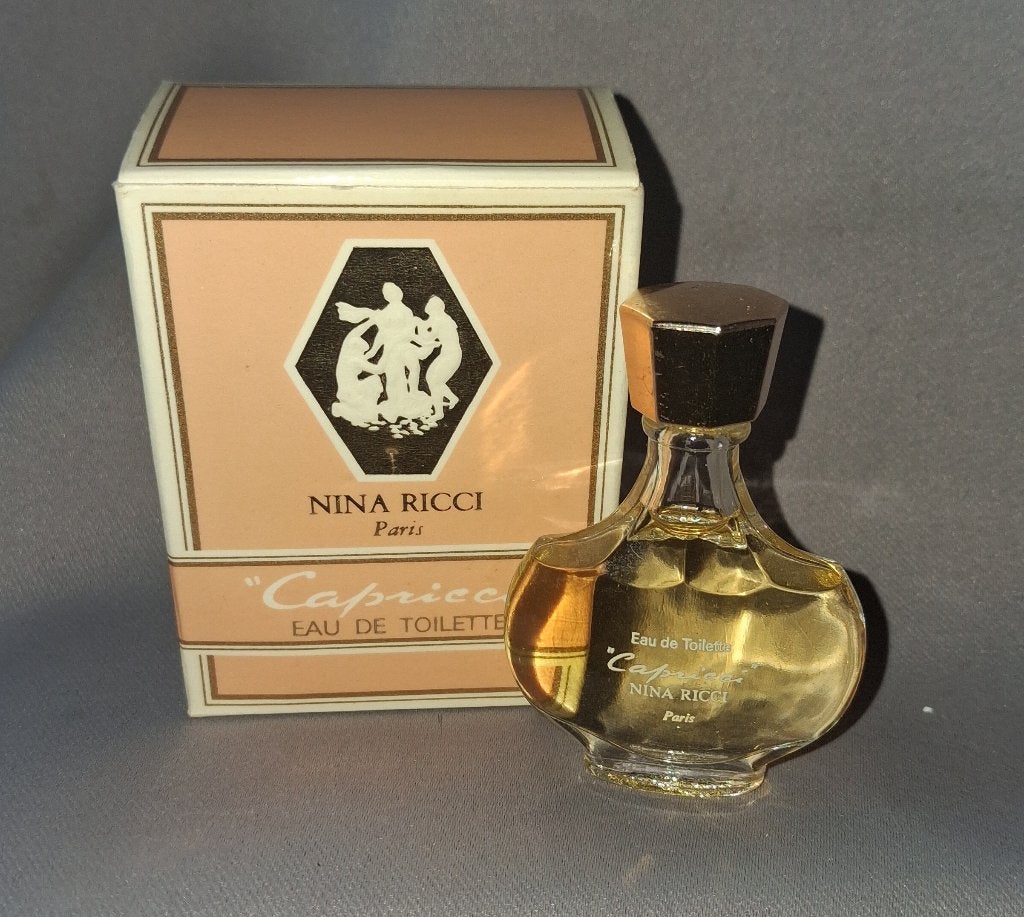 Luxe parfum mini - Nina ricci Capricci Goud + doosje, Ophalen of Verzenden, Zo goed als nieuw, Miniatuur, Gevuld