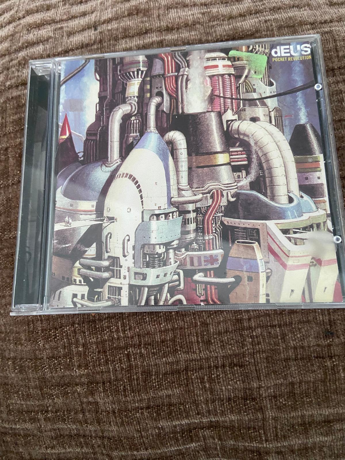 Deus - Pocket revolution, Cd's en Dvd's, Ophalen of Verzenden, Zo goed als nieuw, Poprock