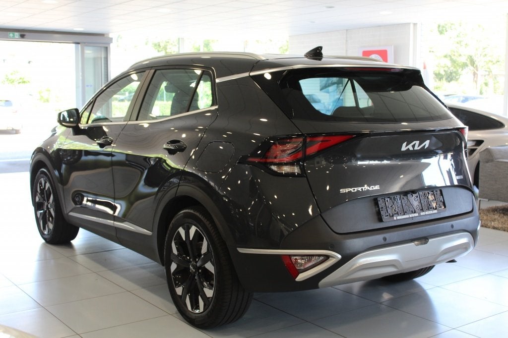 Kia Sportage 1.6 plug-in/CARPLAY/CAMERA/CRUISE (bj 2024), Auto's, Kia, Automaat, Stof, Gebruikt, Zwart