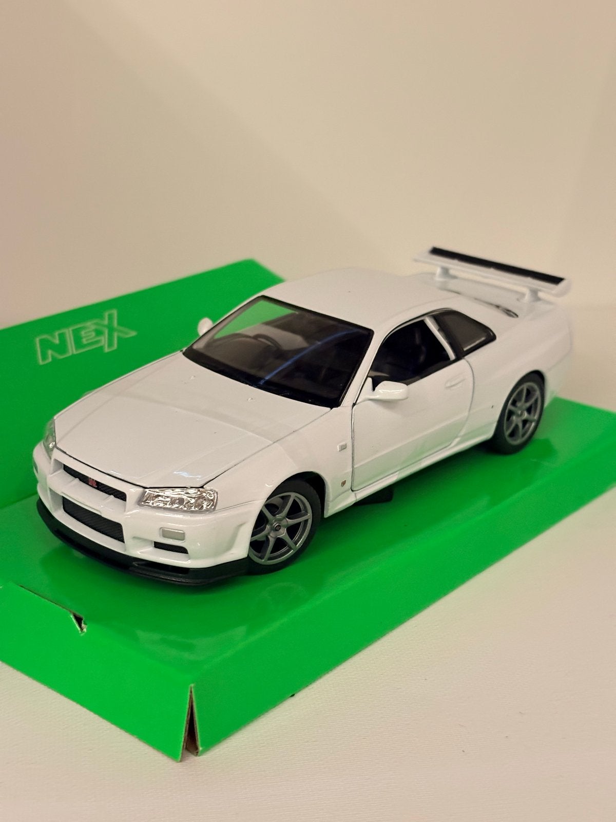 Welly NEX 1:24 Nissan Skyline GT-R (R34) modelauto, Auto, Nieuw, Ophalen of Verzenden, Welly