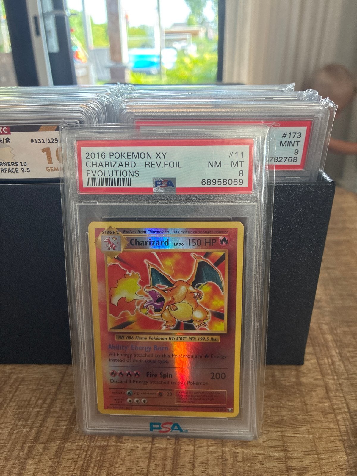 PSA 8 Charizard Reverse Foil 2016 Pokemon XY Evolutions, Hobby en Vrije tijd, Verzamelkaartspellen | Pokémon, Ophalen of Verzenden