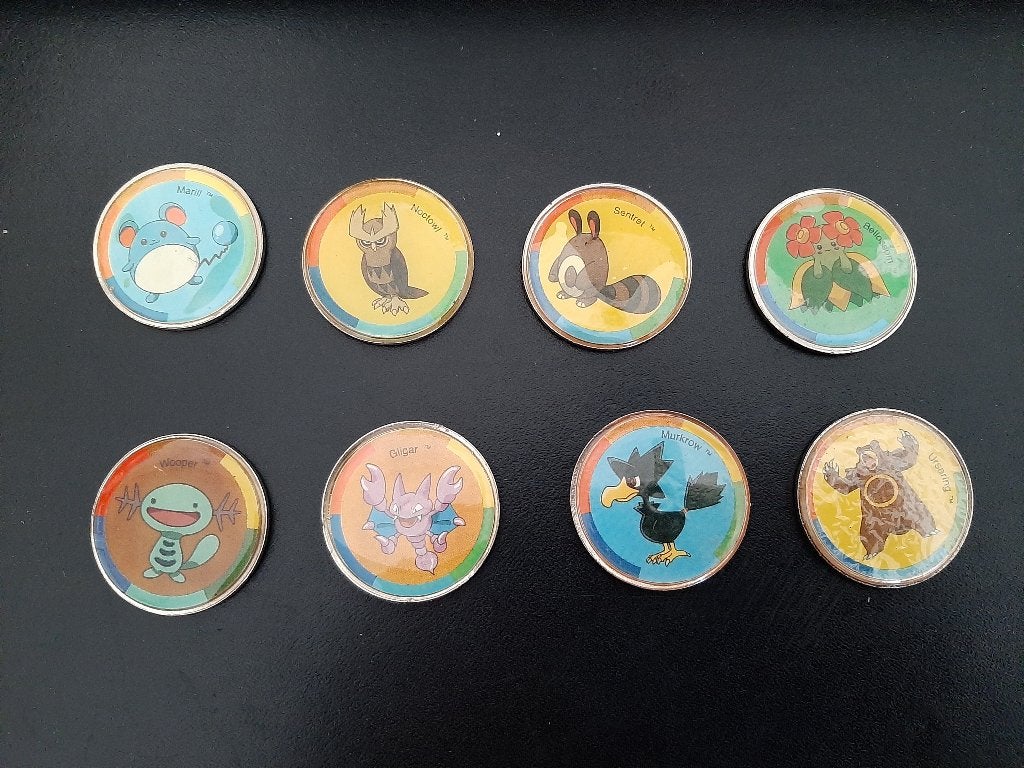 Pokemon munten, 9 stuks. Metaal., Verzenden, Gebruikt, Overige typen