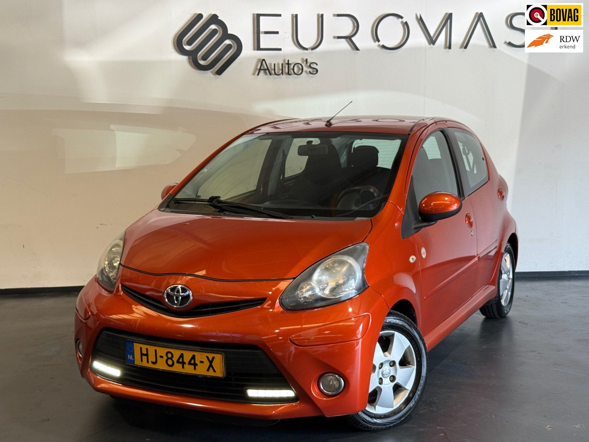 Toyota Aygo 1.0 VVT-i Comfort Orange Airco 5d Elektrische Ra, Voorwielaandrijving, Euro 5, Stof, Gebruikt