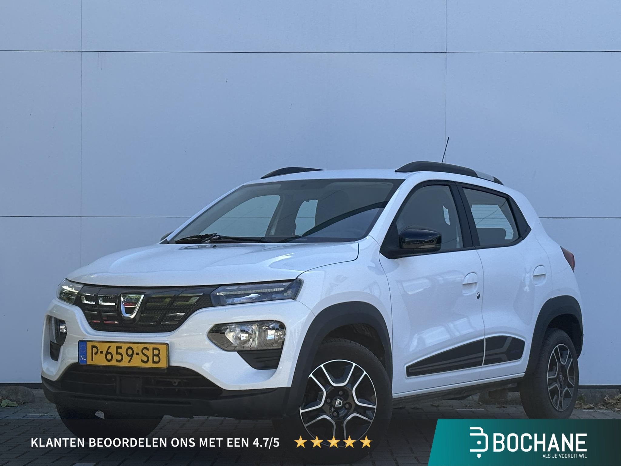 Dacia Spring Comfort 27 kWh | 1e Eigenaar | Airco |, Auto's, Dacia, Gebruikt, 38 min, Leder en Stof, Wit