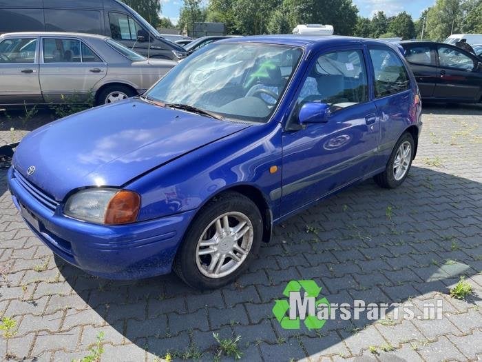 Schokdemperpoot links-voor van een Toyota Starlet, Gebruikt, -, -, Ophalen of Verzenden