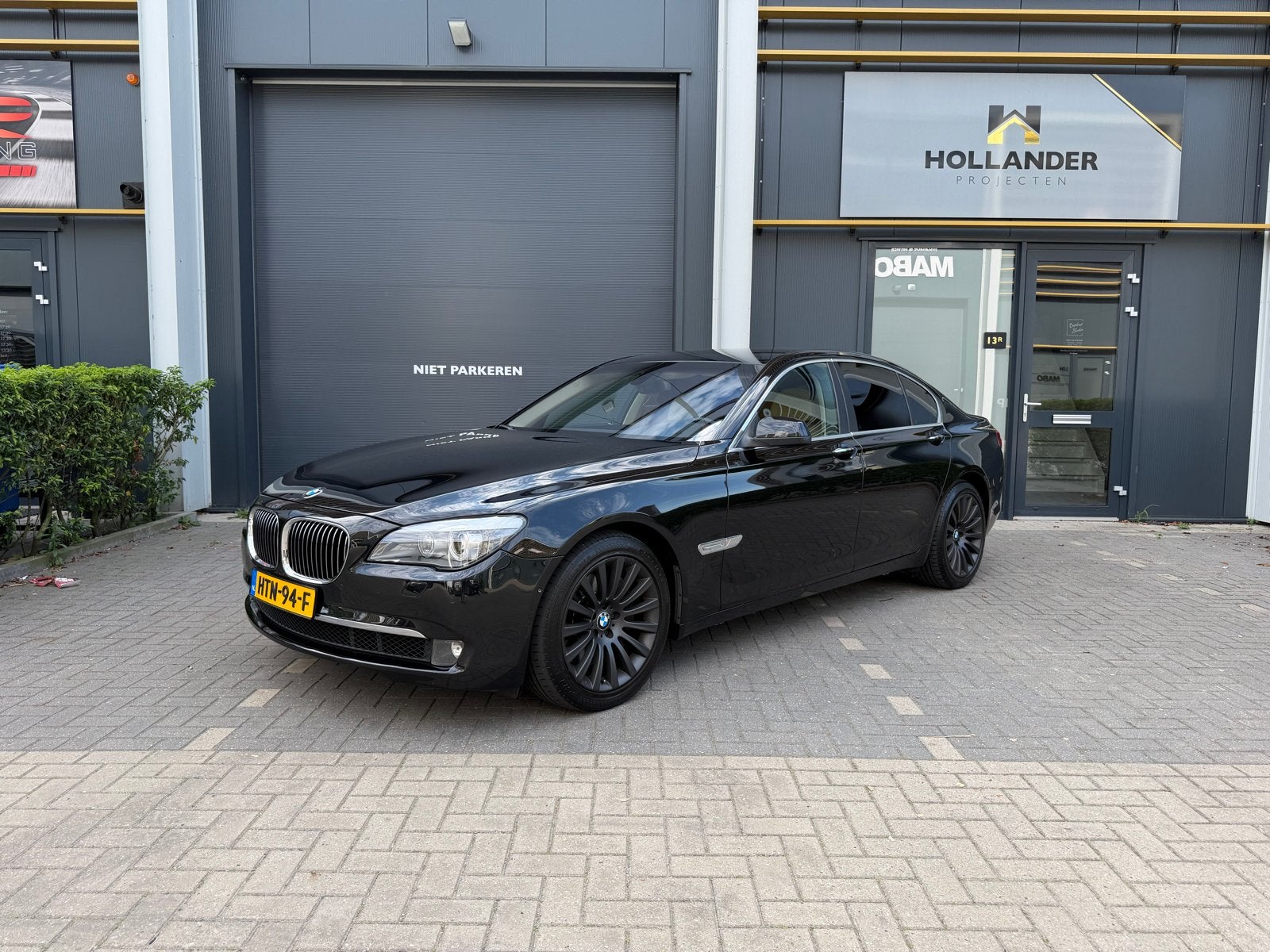 BMW 750i F01 uit 2009, Auto's, BMW, 4395 cc, Zwart, Bedrijf, 408 pk