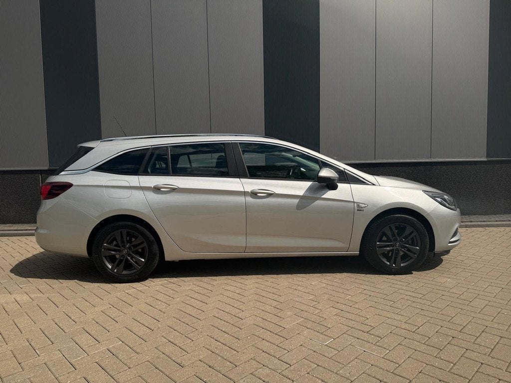 Opel Astra Sports Tourer 1.0 Turbo 120 Jaar Edition, Auto's, Opel, Gebruikt, Euro 6, 620 kg, Origineel Nederlands