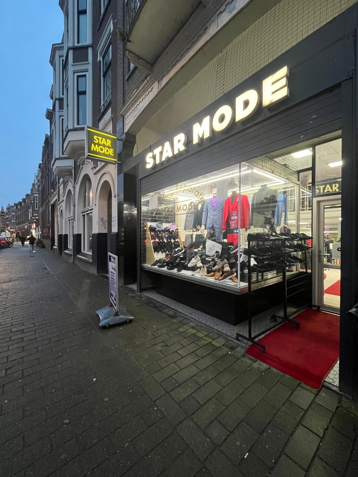 Complete herenmodezaak met voorraad en met kledingreparatie