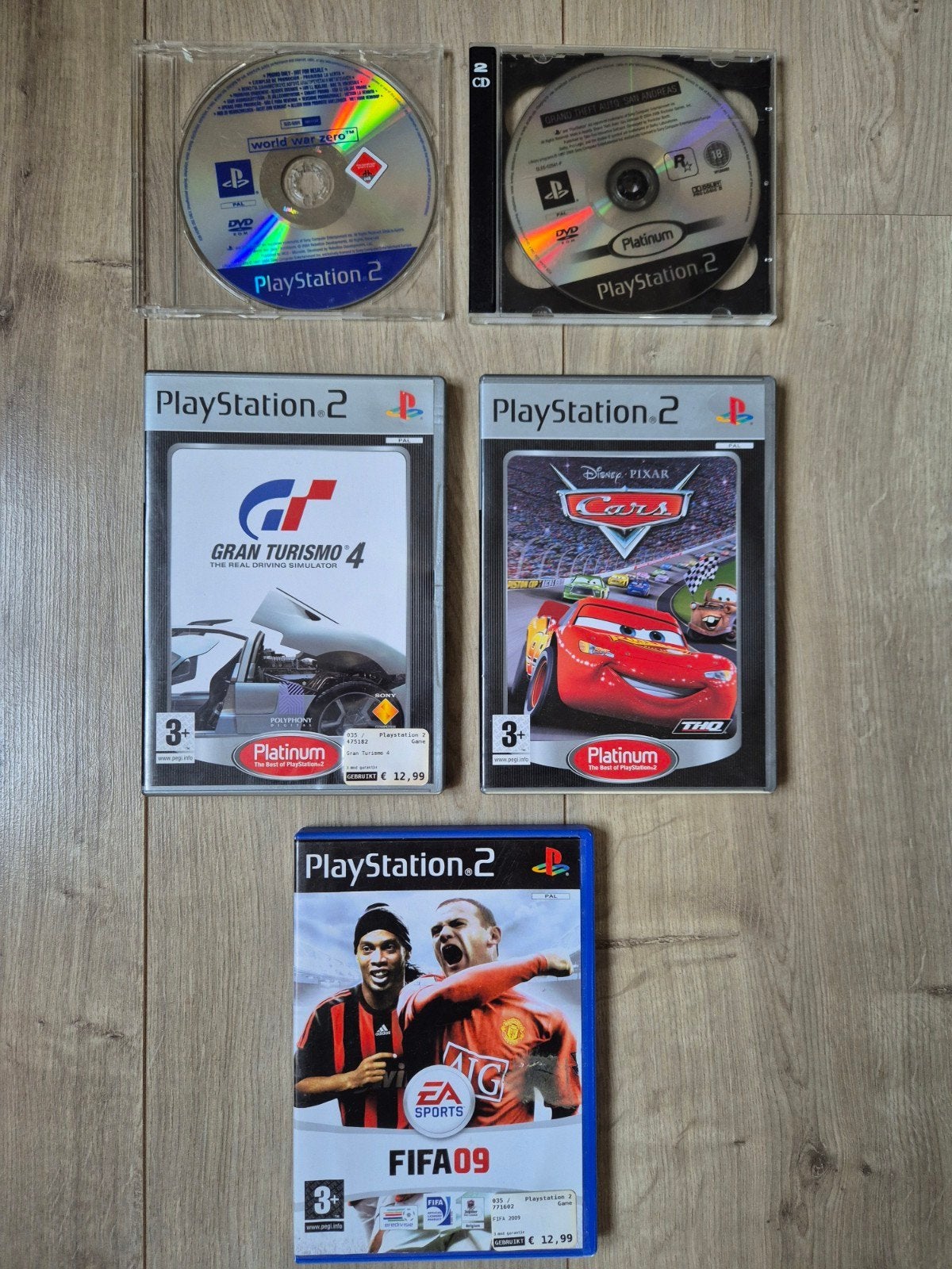 PS2 Games: Gran Turismo 4, Cars, FIFA 09 en World War Zero, Gebruikt, 1 speler, Racen en Vliegen, Eén computer