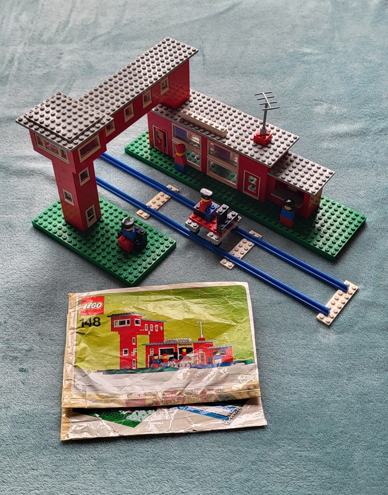 Lego trein 4,5 Volt blauwe rails station (set 148) boekje., Gebruikt, Lego, Ophalen of Verzenden, Compleet
