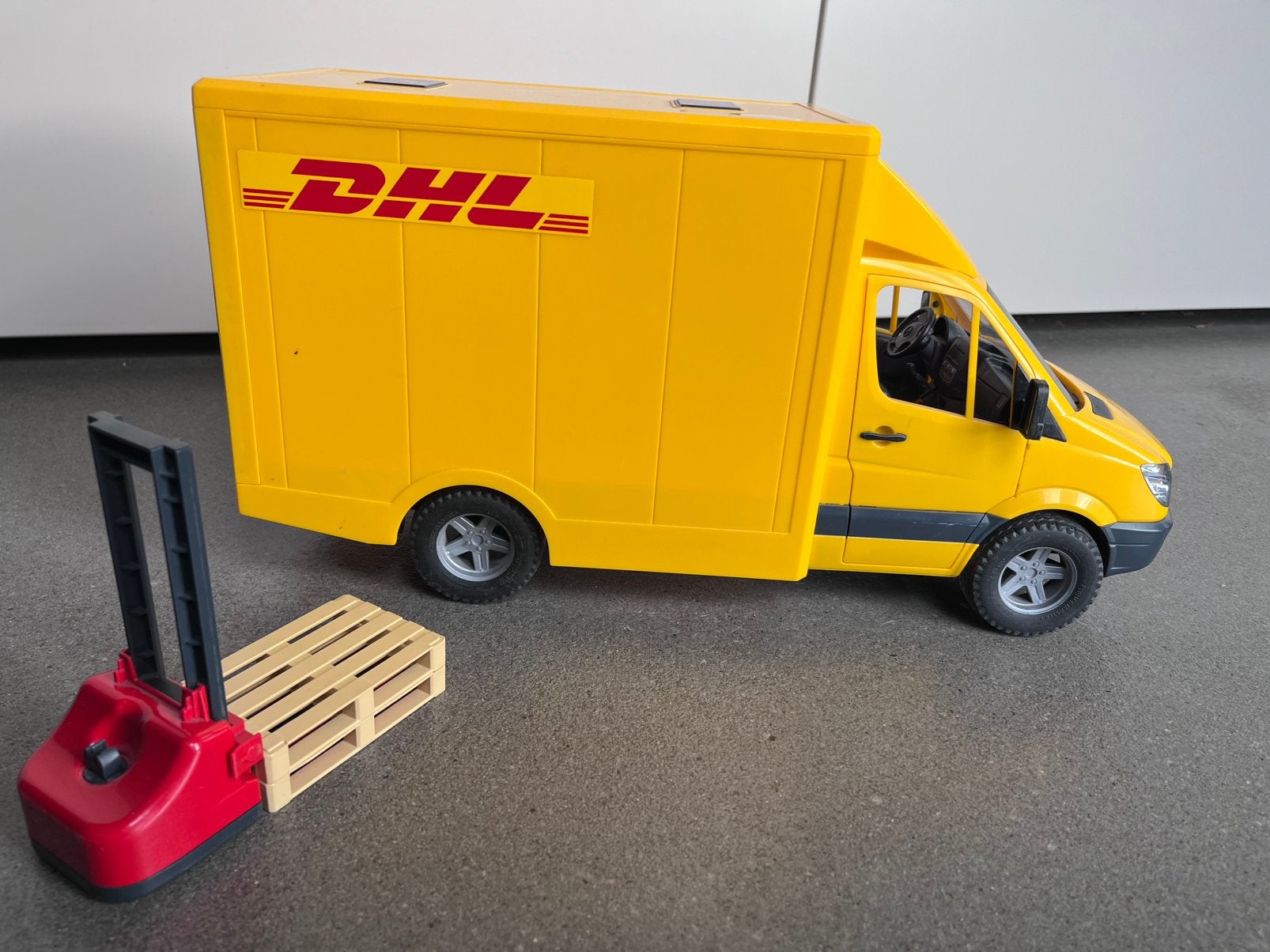 Bruder DHL wagen, Ophalen of Verzenden, Zo goed als nieuw