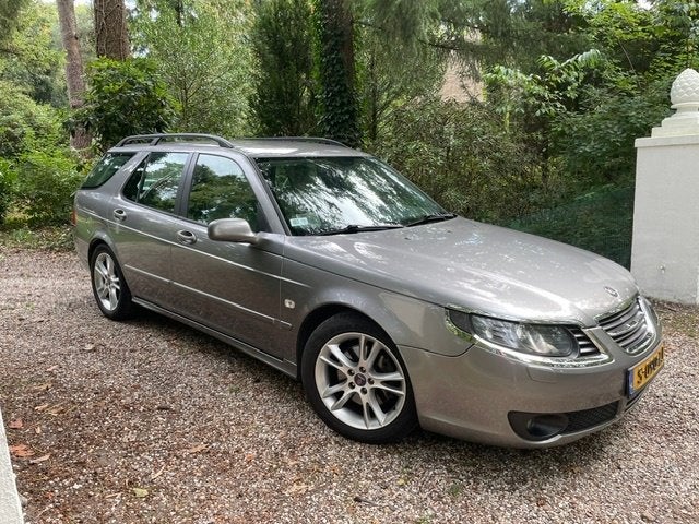 Saab 9-5 2.3 Turbo Aero Sport Estate AUT 2005 Grijs, Auto's, Dealer onderhouden, 1800 kg, Beige, 4 cilinders