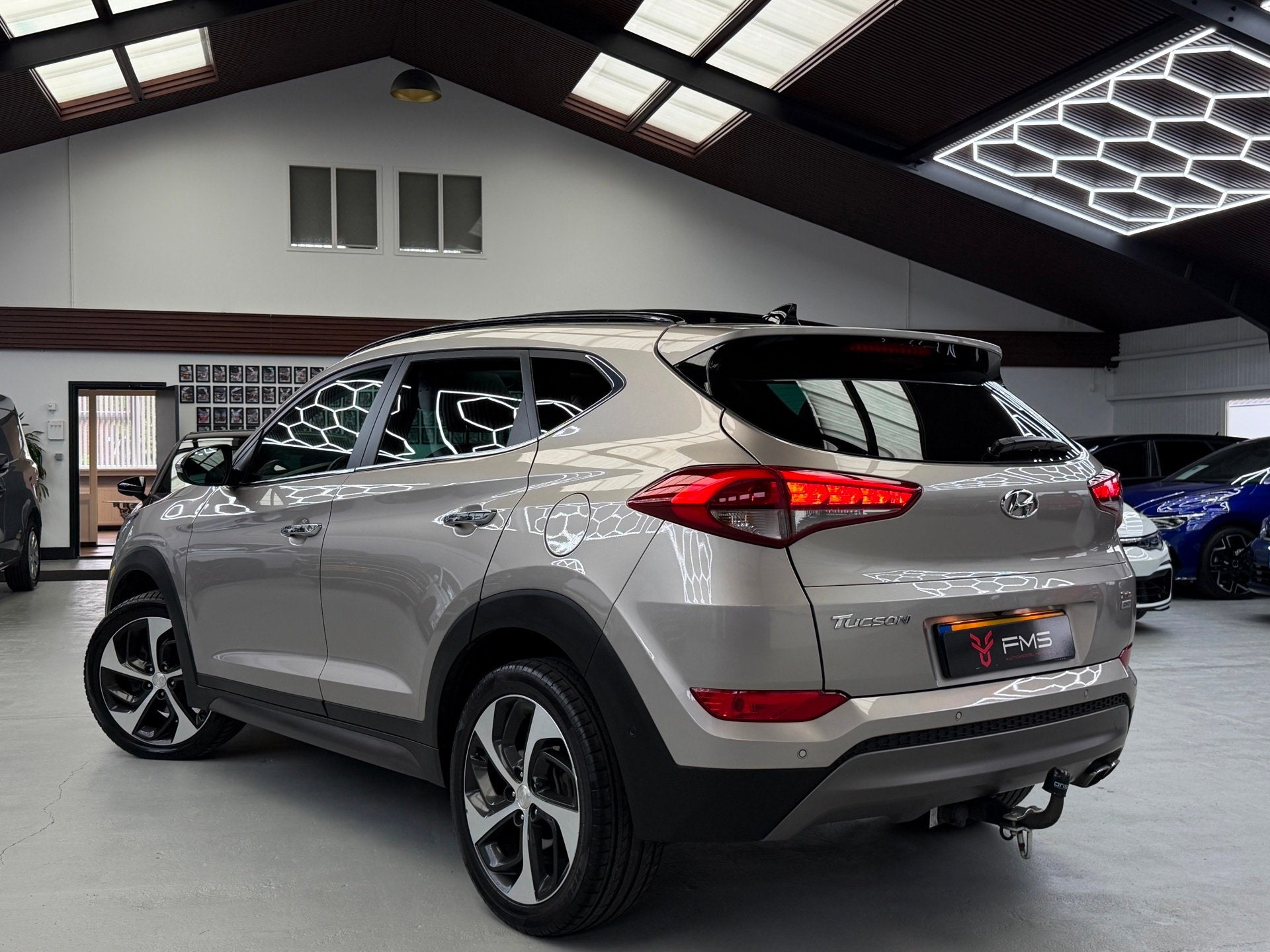 Hyundai Tucson 1.6 T-GDi 4WD Camera Trekhaak Panorama, Auto's, Gebruikt, 4 cilinders, Met garantie (alle), Leder