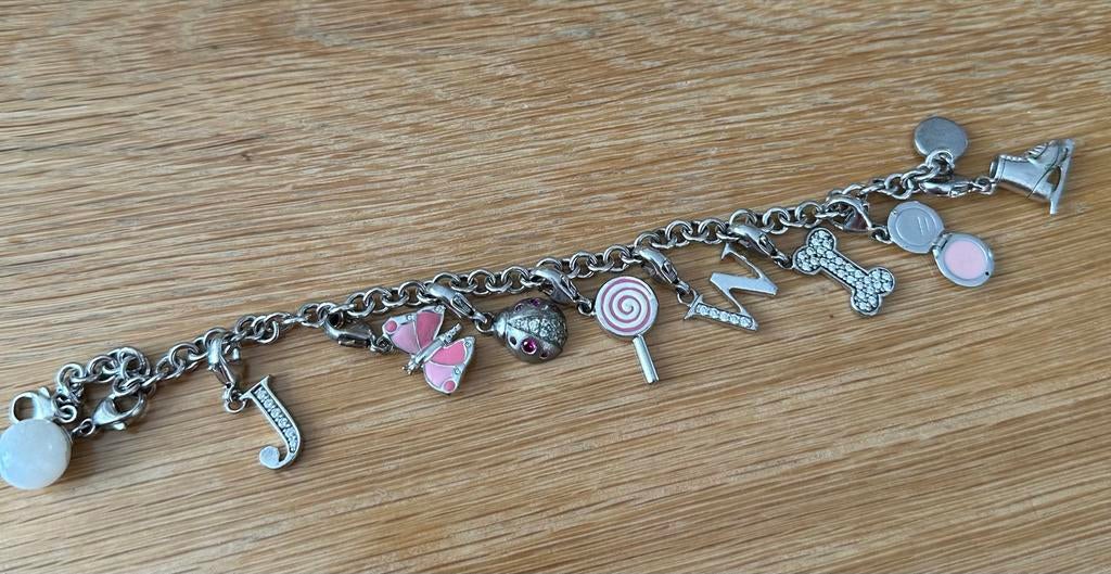 2 mooie Fossil armbanden met bedels, Staal, Ophalen of Verzenden, Zo goed als nieuw, Met bedels of kralen