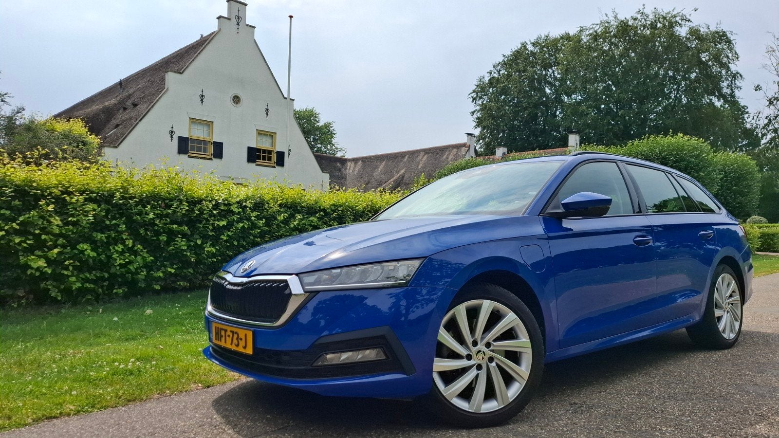 Skoda Octavia 1.4 TSI iV 204pk PHEV Business 11-2021, Auto's, Stof, Blauw, Plug-in hybride, Dealer onderhouden