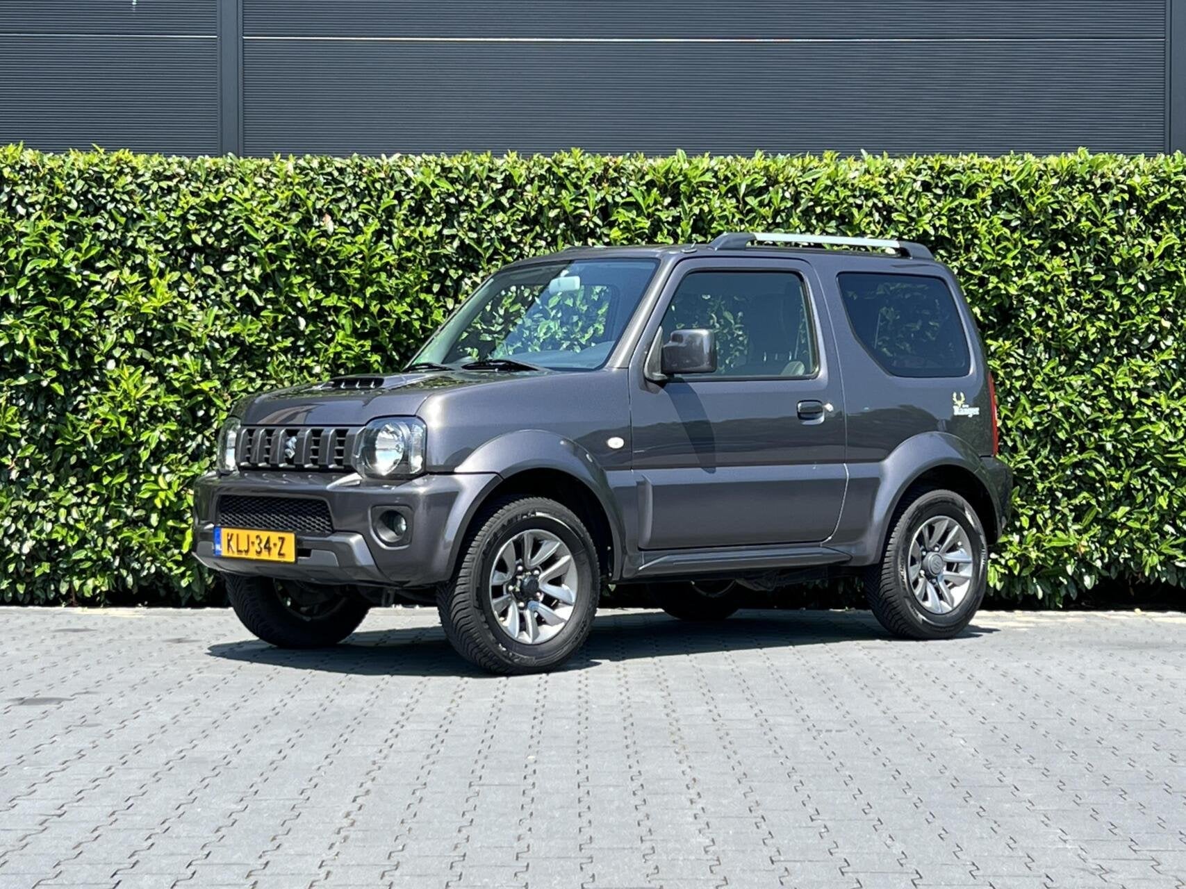 Suzuki Jimny 1.3 Exclusive RANGER, LEDER, AIRCO, STOELVERWAR, Auto's, Suzuki, 86 pk, Gebruikt, Zwart, 4 stoelen