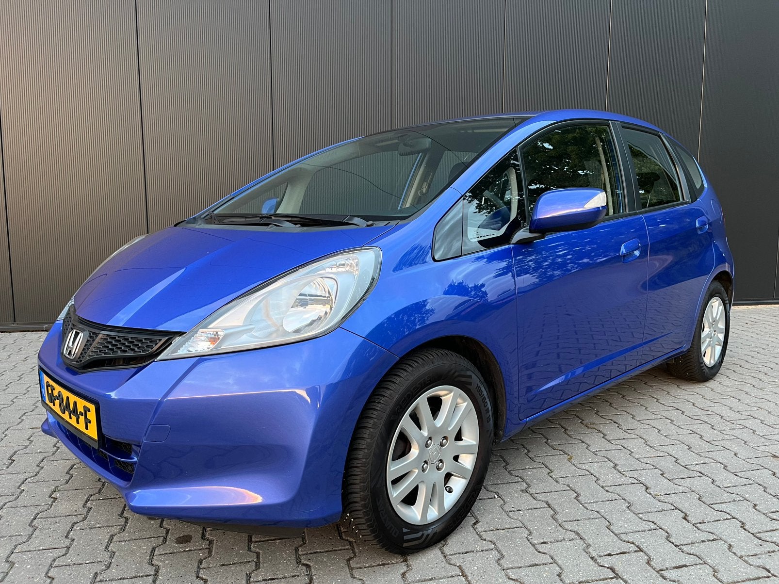 Honda Jazz 1.4 aut. 2e eigenaar. Bijna nieuw. Allseasonband., Auto's, Honda, Euro 5, Stof, Zwart, 4 cilinders
