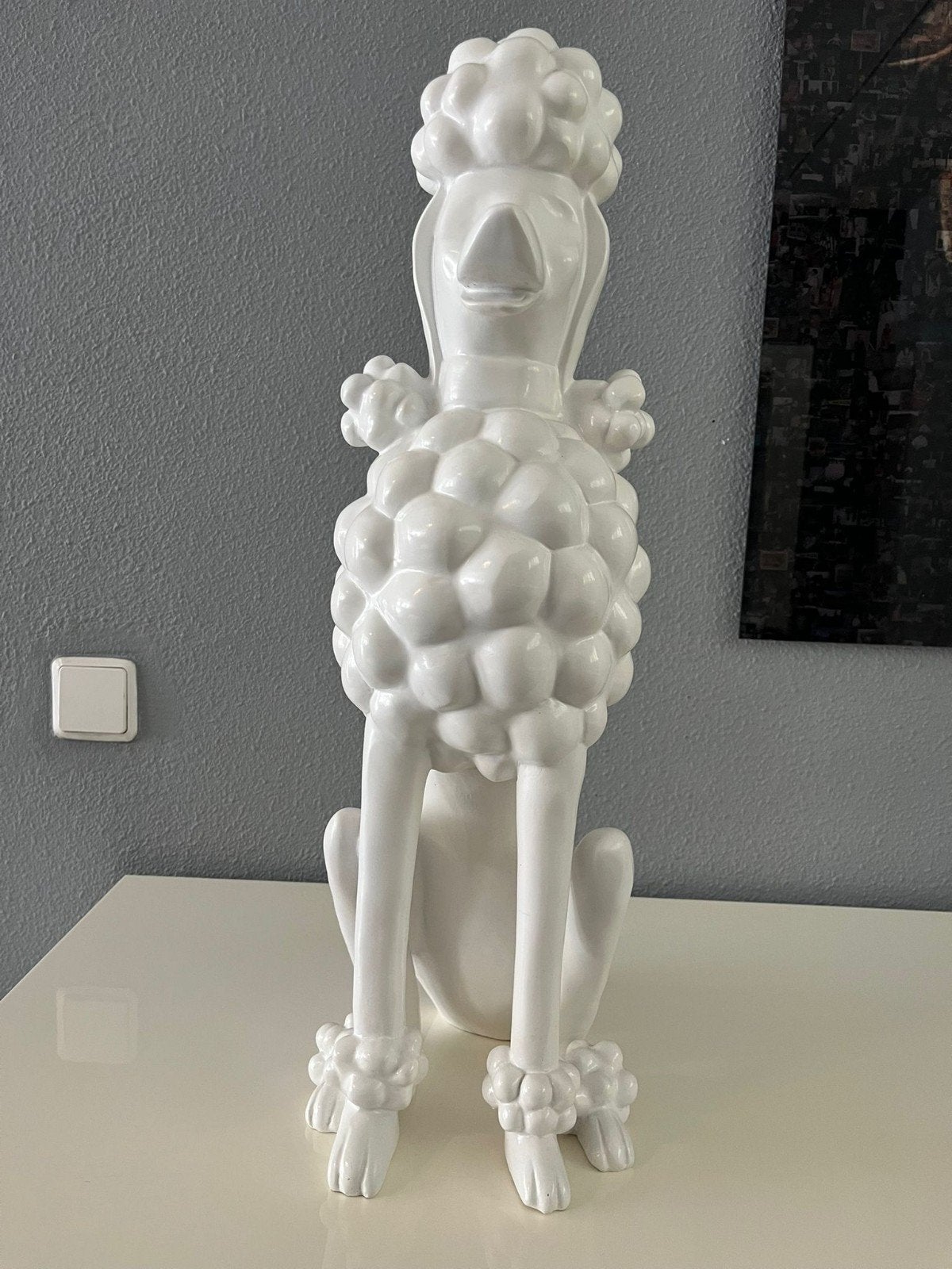Beeld witte poedel, Ophalen