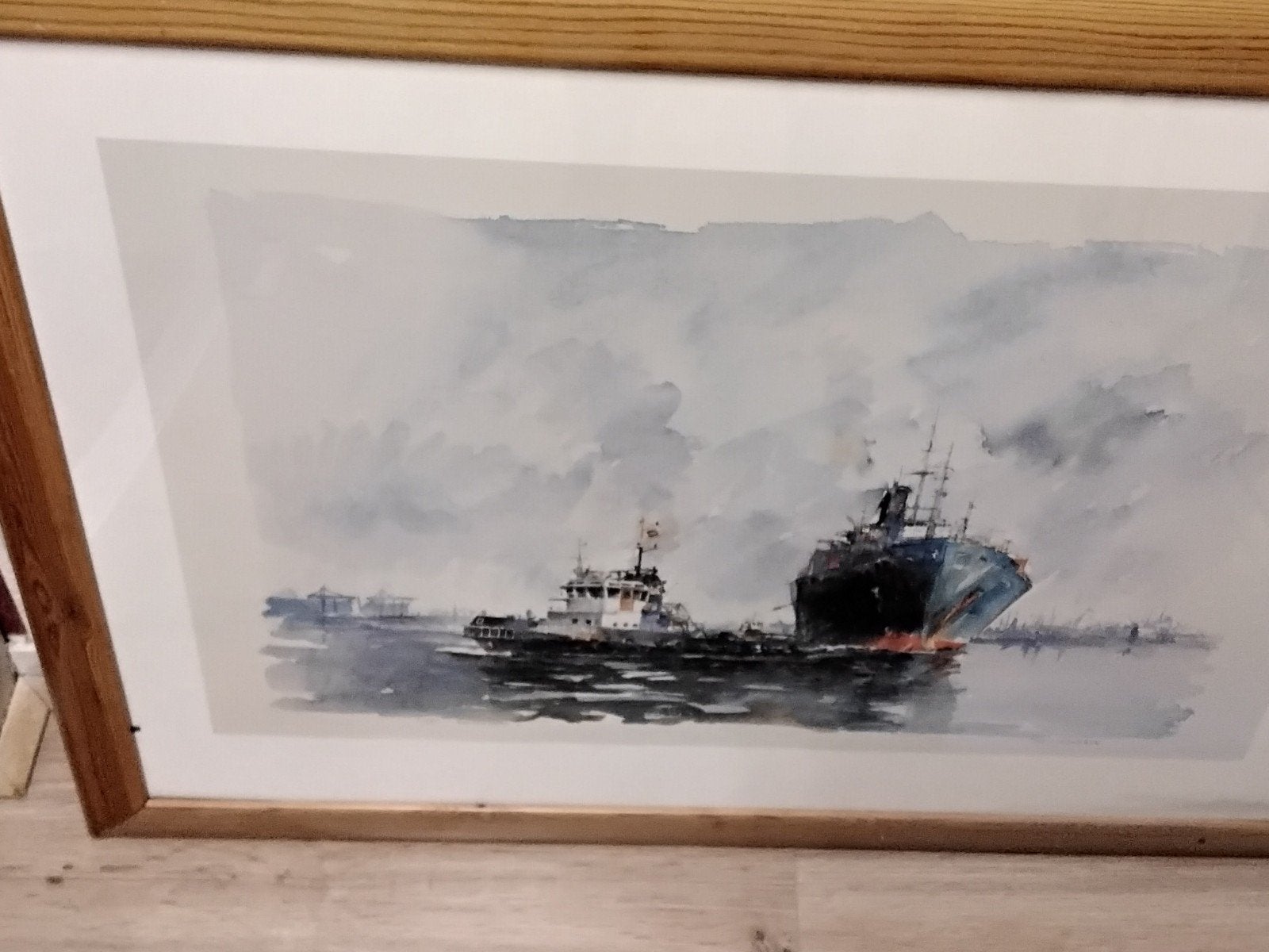 Maritiem schilderij: sleepboot en vrachtschip, Ophalen