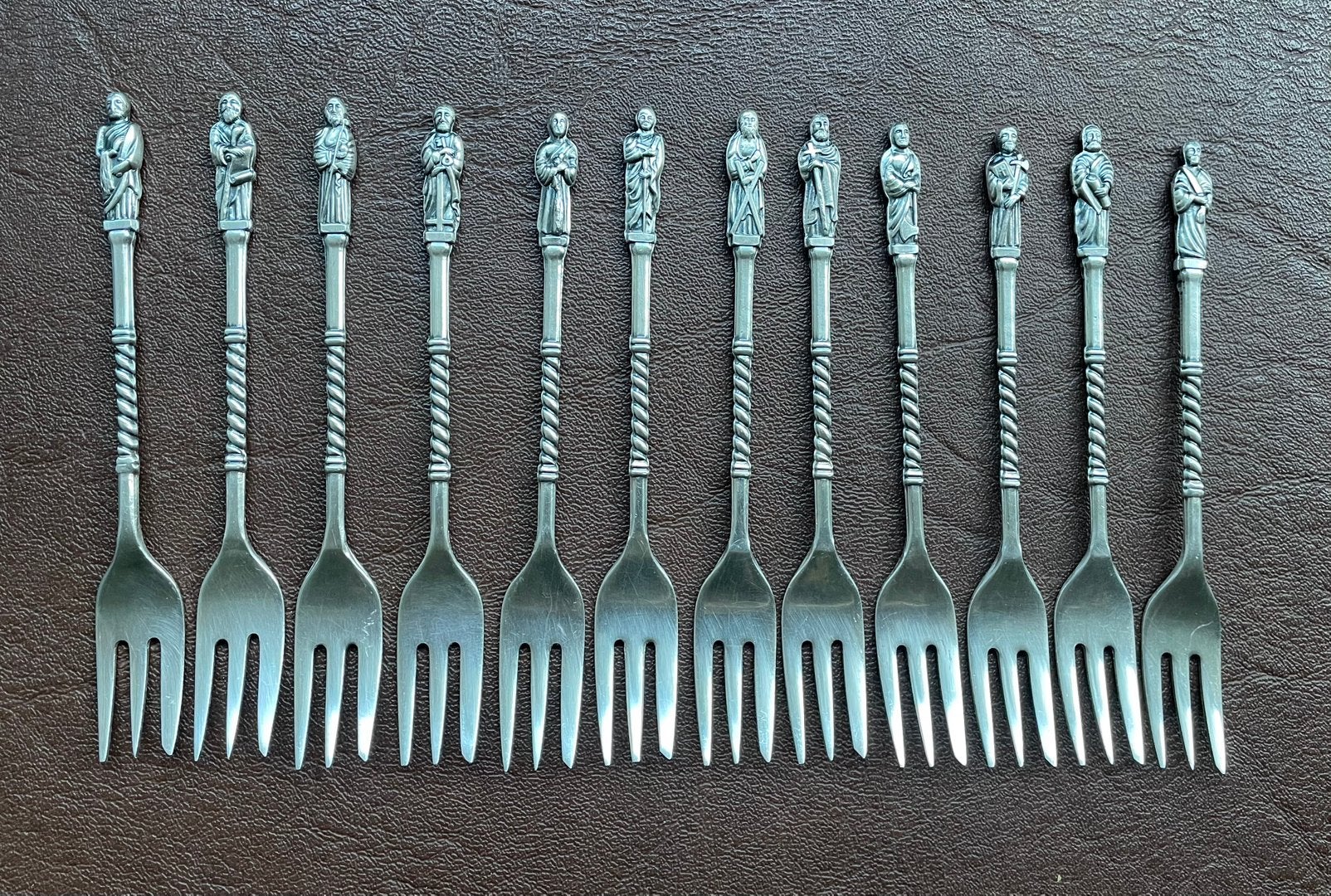 Set van 12 verzilverde vorkjes met apostelbeeldjes, Antiek en Kunst, Ophalen of Verzenden