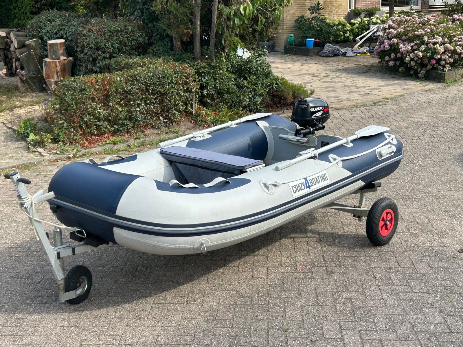 Rubberboot + 2,5pk 4 tact + trailer, Ophalen, Zo goed als nieuw