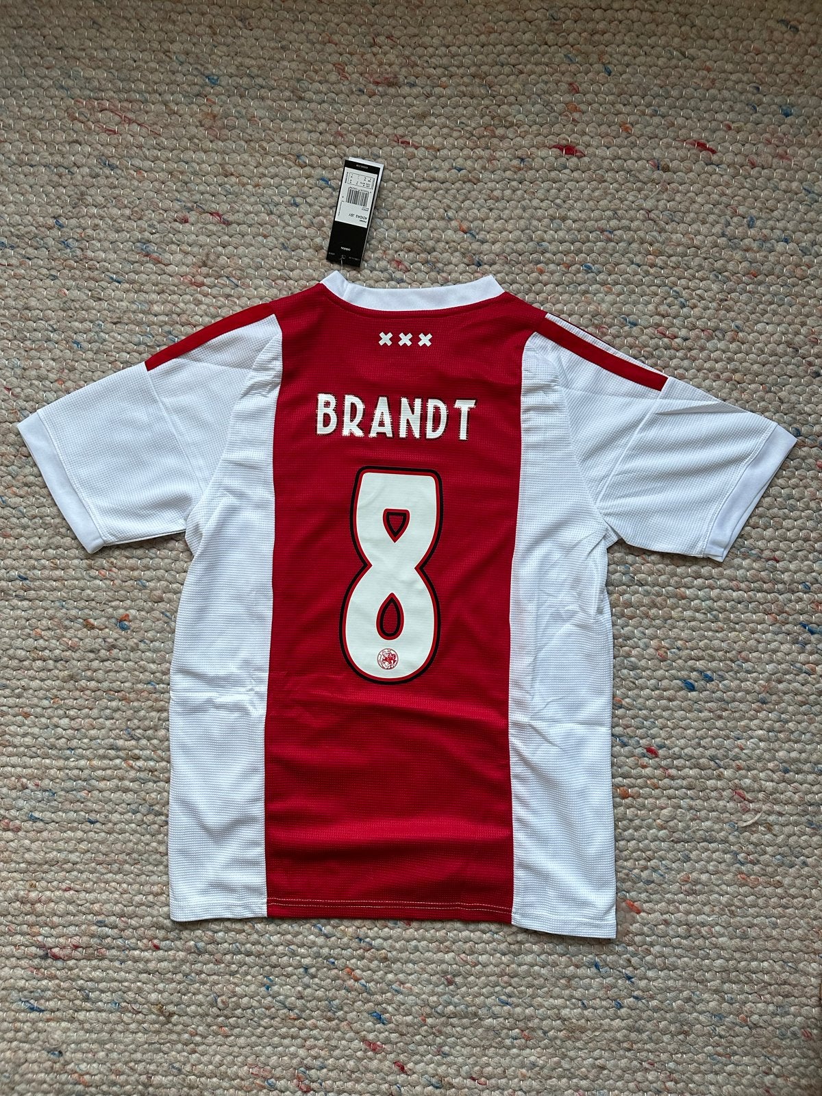 Ajax 2026/2027 thuisshirt Brandt #8 (M/L) - Nieuw, Maat 48/50 (M), Nieuw, Ophalen of Verzenden, Voetbal