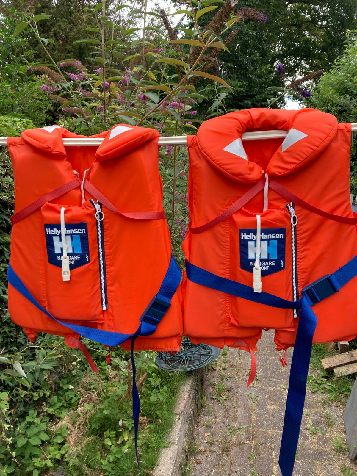 Reddingsvesten Helly Hansen.Oranje/blauw., Watersport en Boten, Watersportkleding, Ophalen, Dame of Heer, Reddingsvest of Zwemvest