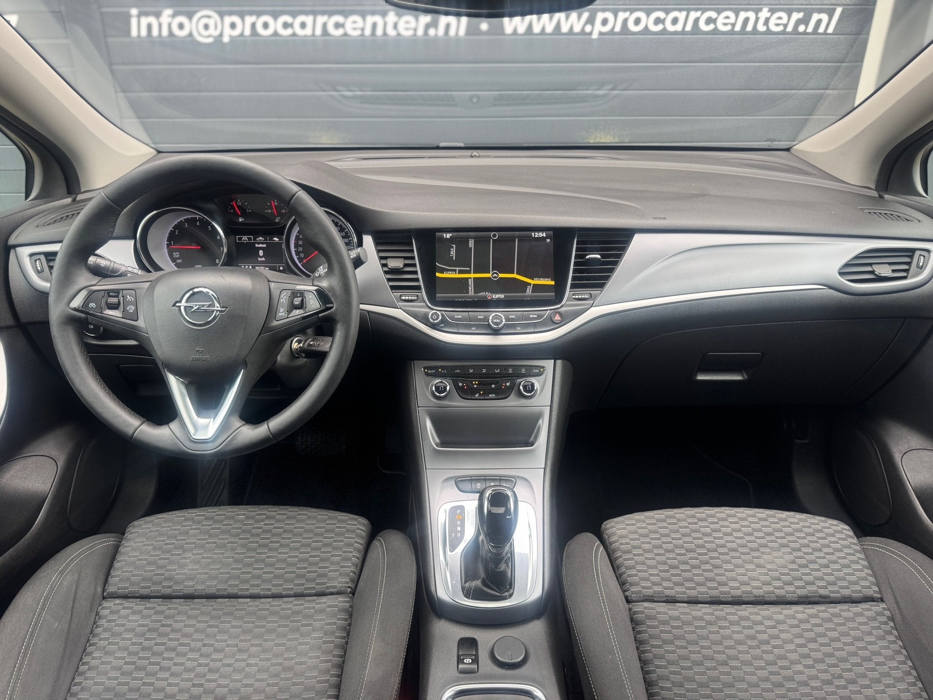 Opel Astra 1.4 Business+ Aut | Dak | Cruise | Climate | Stoe, Auto's, Gebruikt, Euro 6, 150 pk, Blauw