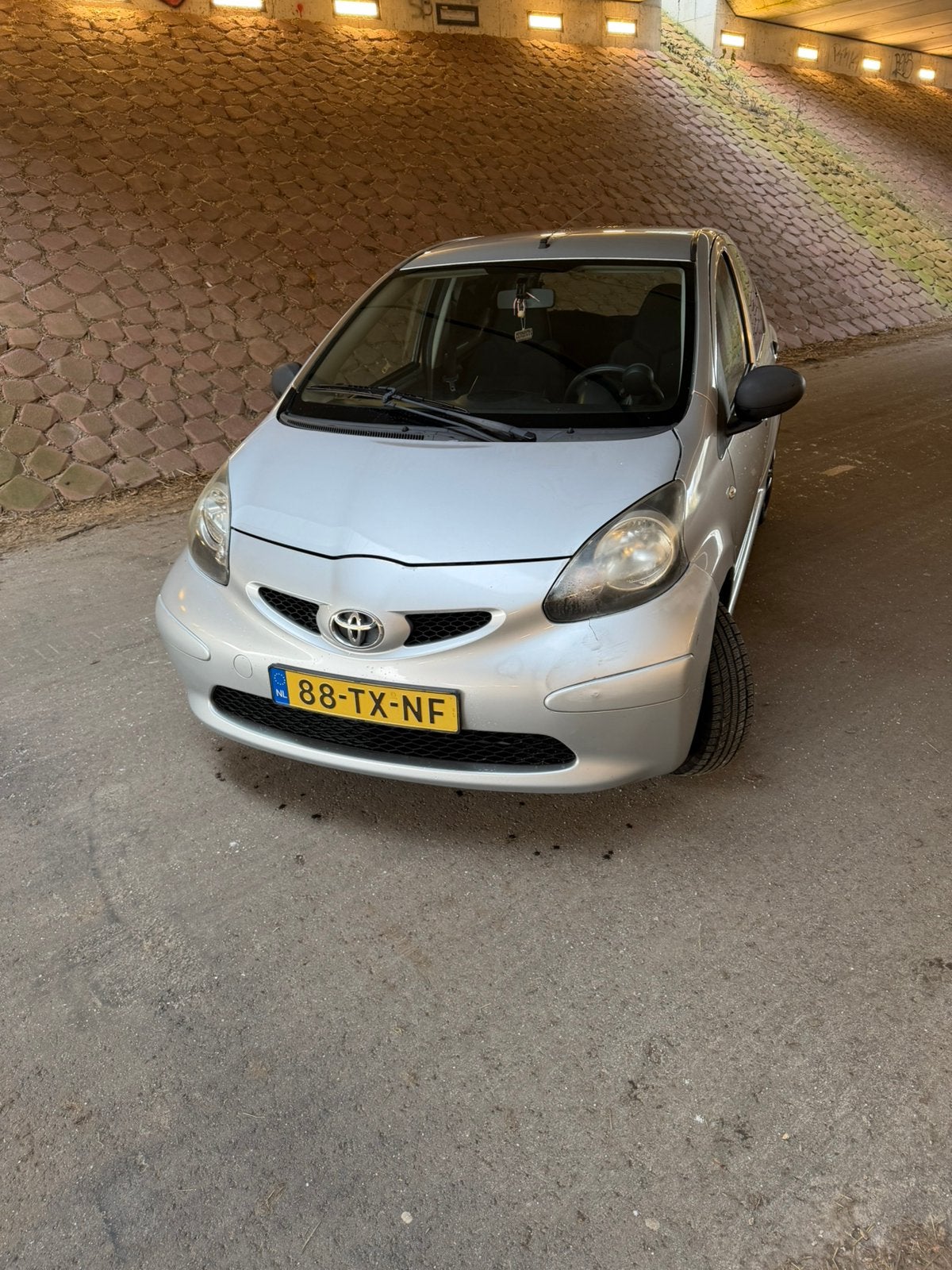 Toyota Aygo 1.0 12V Vvt-i 5DRS 2007 Grijs, Ophalen of Verzenden