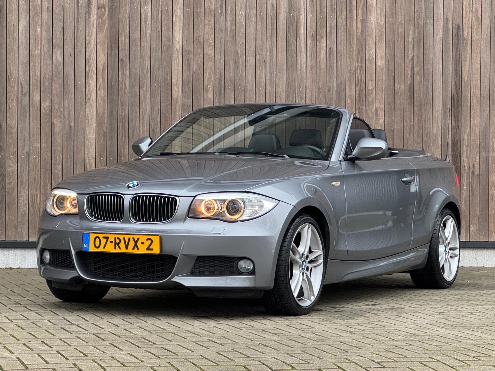 BMW 1-serie Cabrio 118i High Executive M-Sport, Auto's, BMW, Euro 5, Achterwielaandrijving, Zwart, Cabriolet