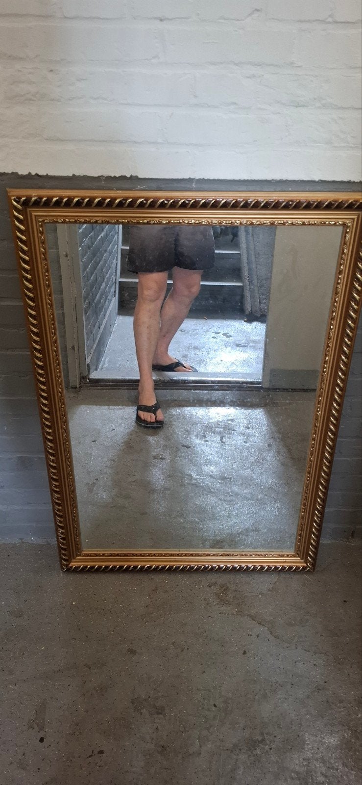 Spiegel met gouden houten lijst, Ophalen
