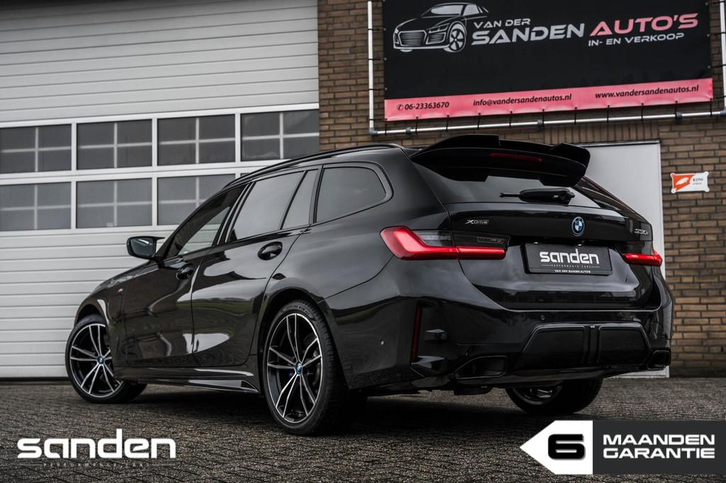 BMW 330e Touring xDrive M Sport|Pano|Mstoelen|Memory|LED|HUD, 1998 cc, 4 cilinders, Zwart, Leder