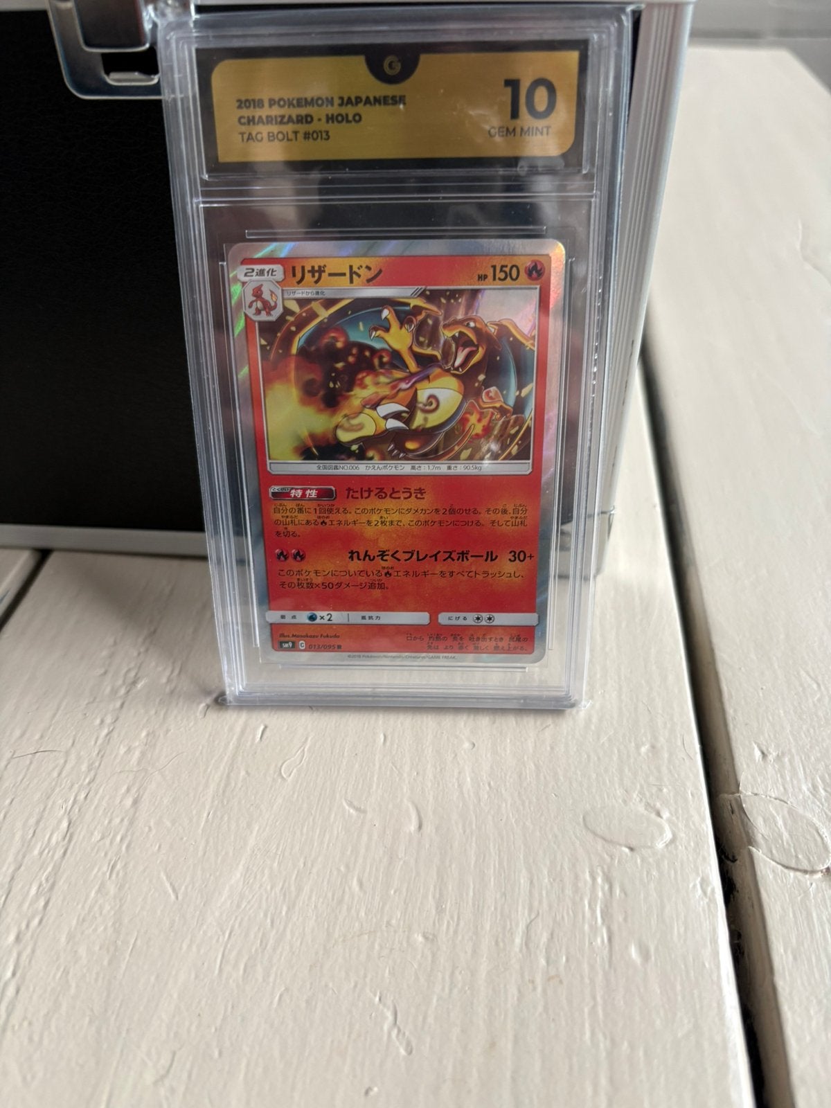 Charizard tag bolt grade 10, Ophalen of Verzenden, Zo goed als nieuw, Meerdere kaarten, Foil