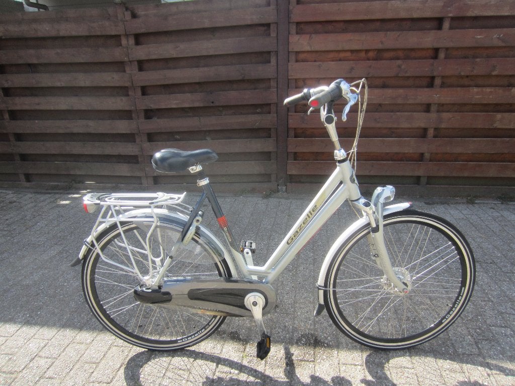 damesfiets gazelle orange in prima staat, Ophalen, Versnellingen, 56 cm of meer, Zo goed als nieuw