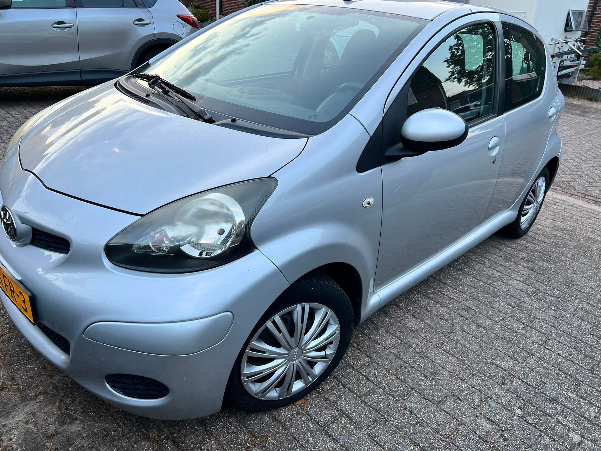 Toyota Aygo 1.0-12V Comfort Automaat., Auto's, Stof, Gebruikt, Zwart, 4 stoelen